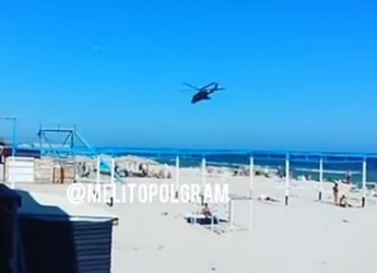 В Кирилловке отдыхающих "развлекают" вертолеты, летающие над пляжем (видео)