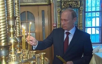 Путин поставил свечи за "защитников Новороссии" (видео)