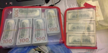 У кабінеті київського полісмена виявили 100 тисяч доларів: оголошено підозру