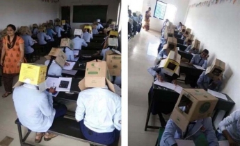 В індійському коледжі дітей змусили складати іспит в картонних коробках на головах (фото)