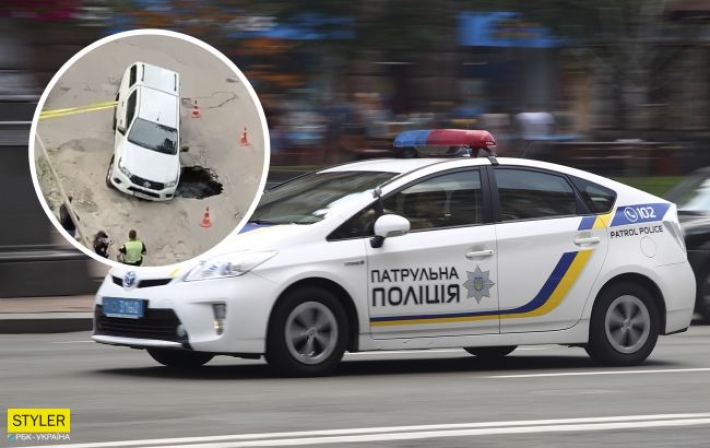 В Киеве внедорожник провалился под асфальт в яму: видео инцидента