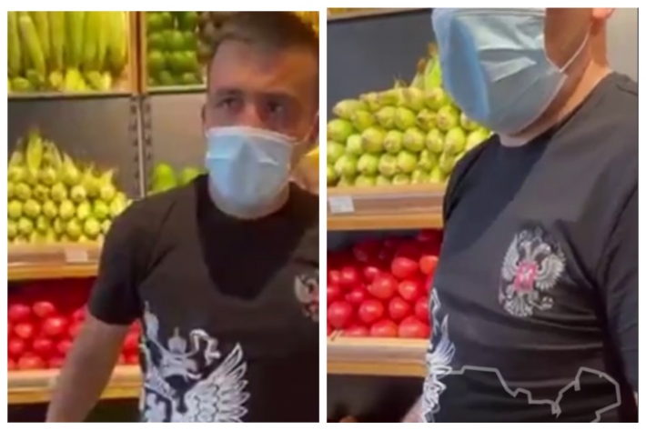 В Киеве активисты устроили грузчику "модный приговор" за герб России на футболке: видео